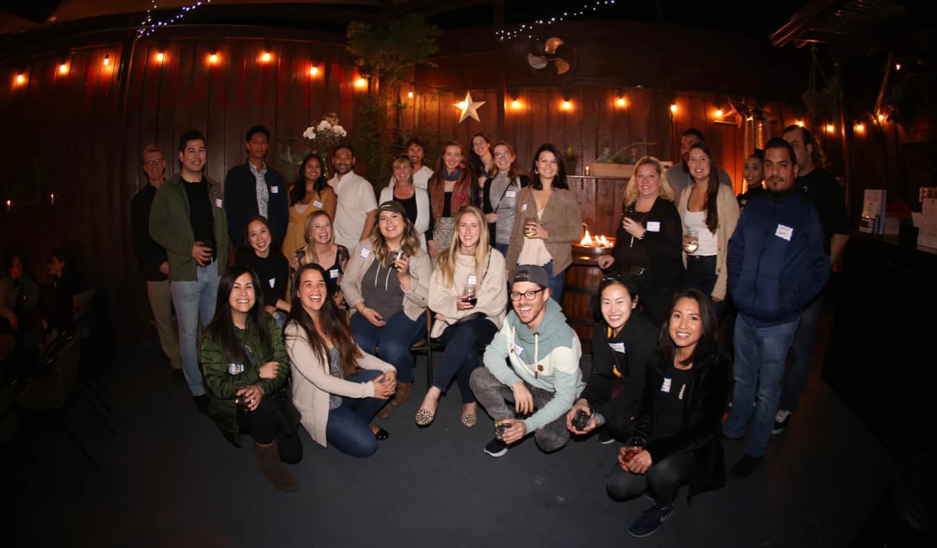 A group of travelers meeting at a bar for The Nomadic Network