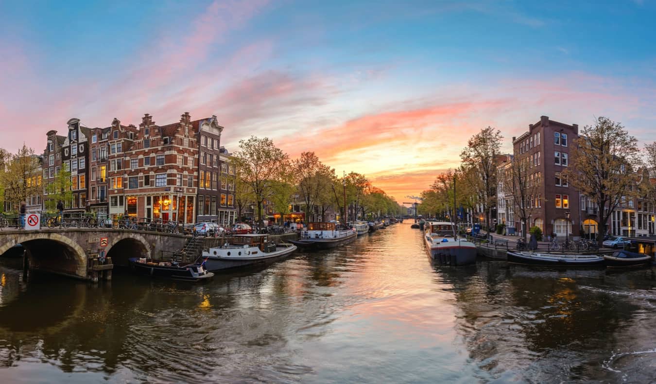 A scenic empty canal at sunset in Amsterdam, Netherlands