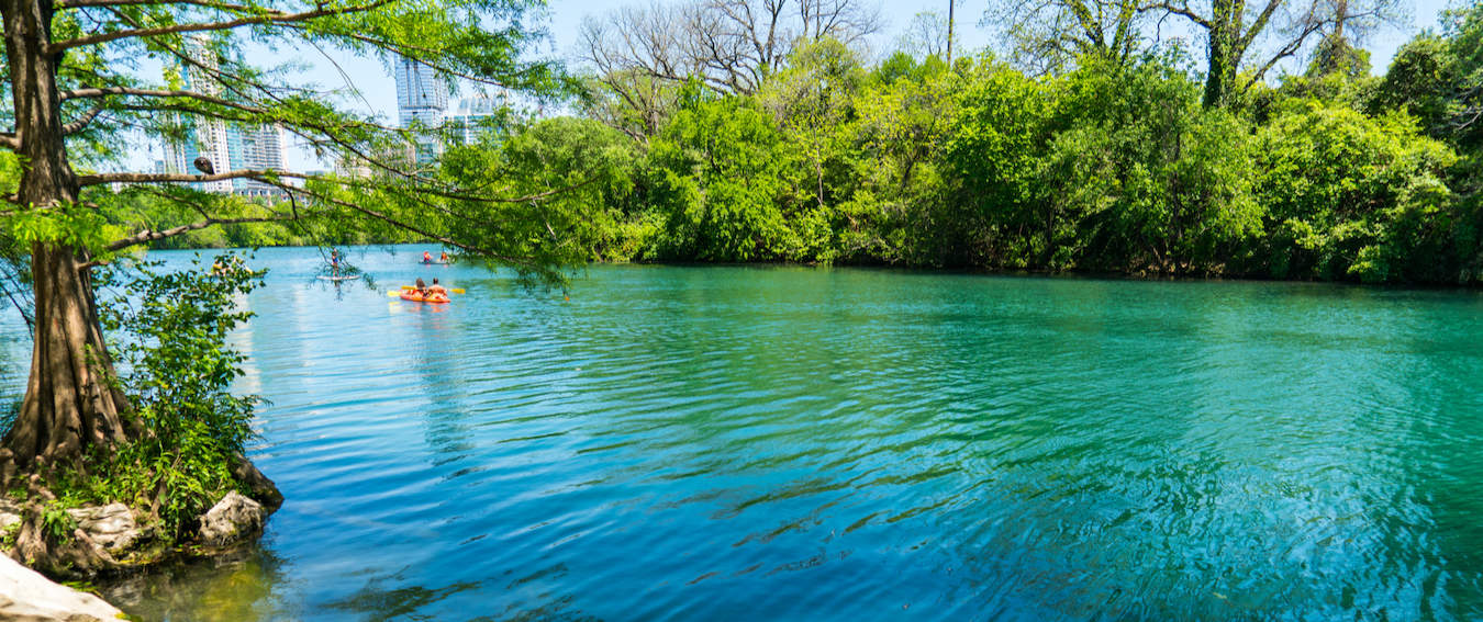 People swimming and enjoy Barton Springs in Austin, Texas