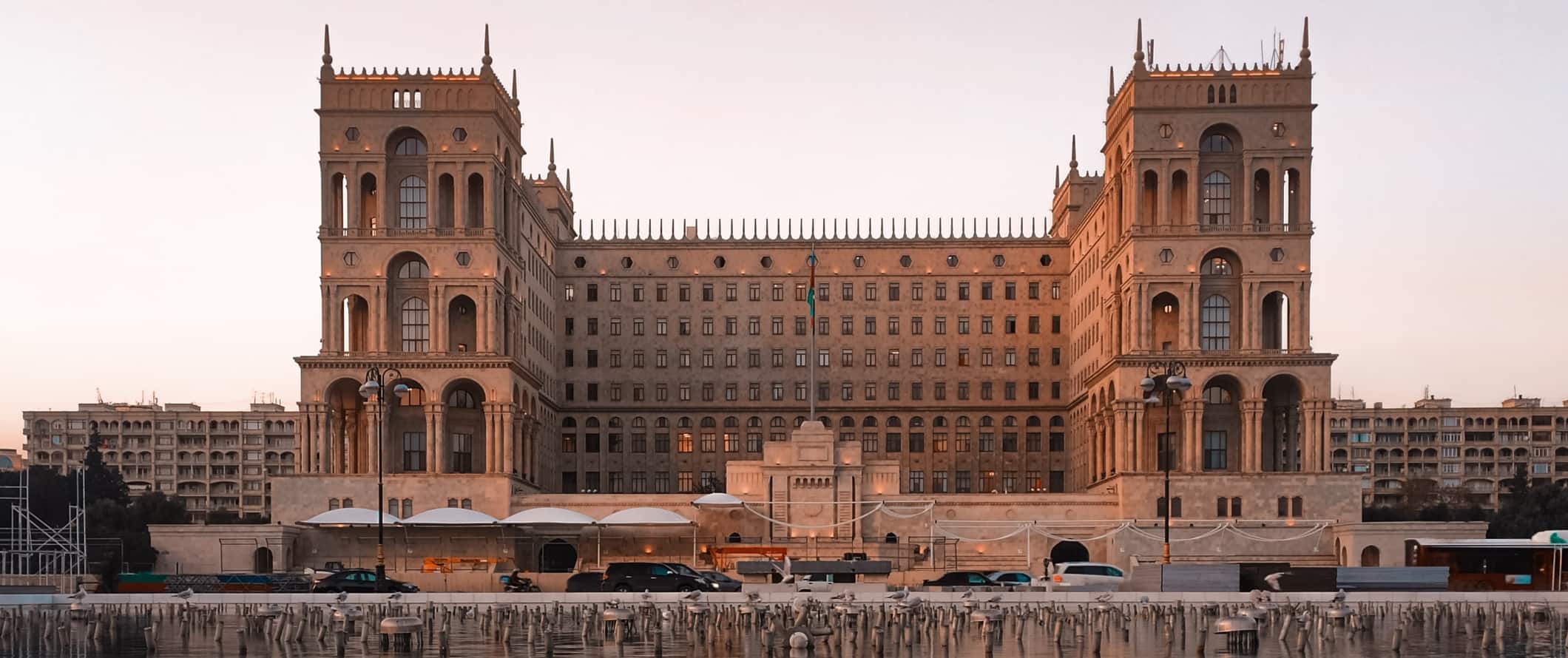Imposing historic government building in Baku, Azerbaijan at sunset