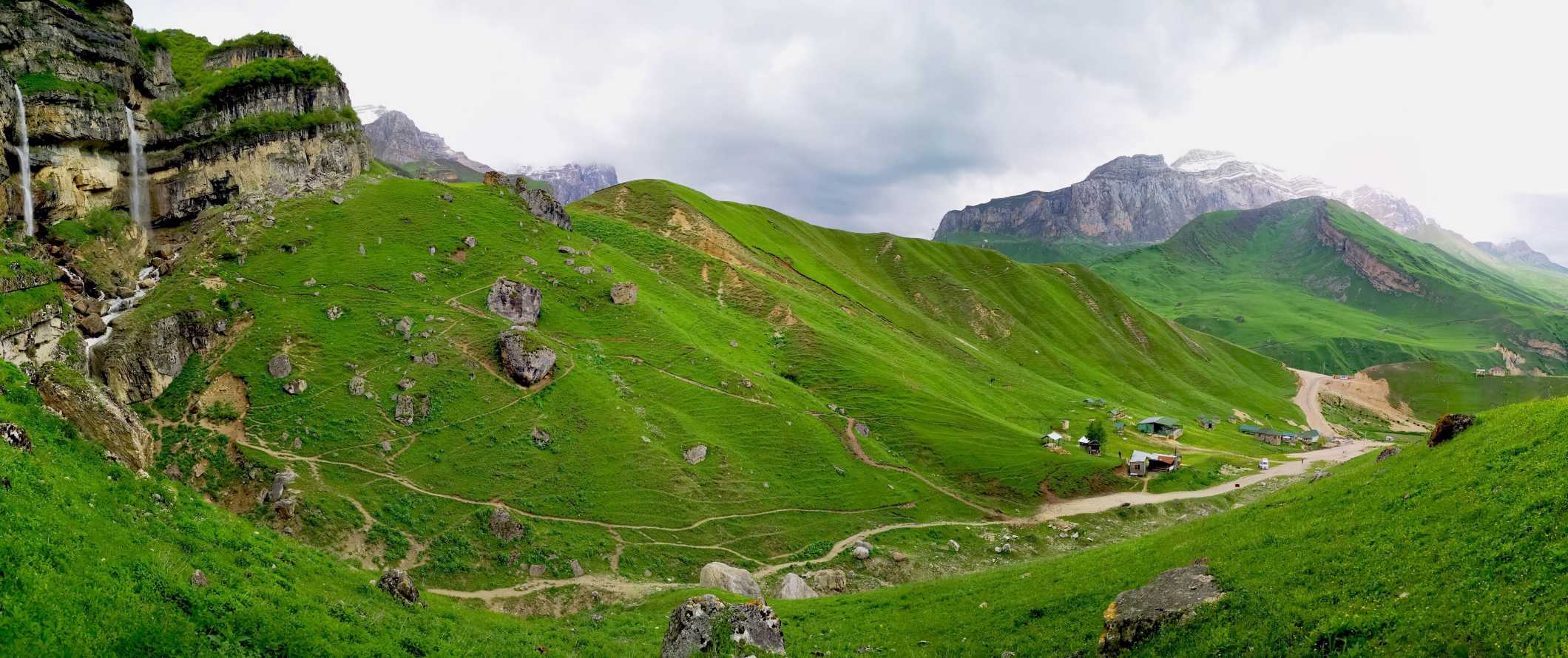 Sweeping mountain views with dirt paths snaking through a valley in Azerbaijan