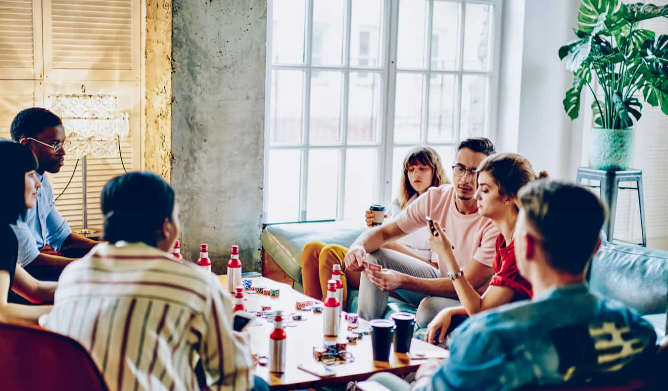 People having fun hanging out at a hostel overseas