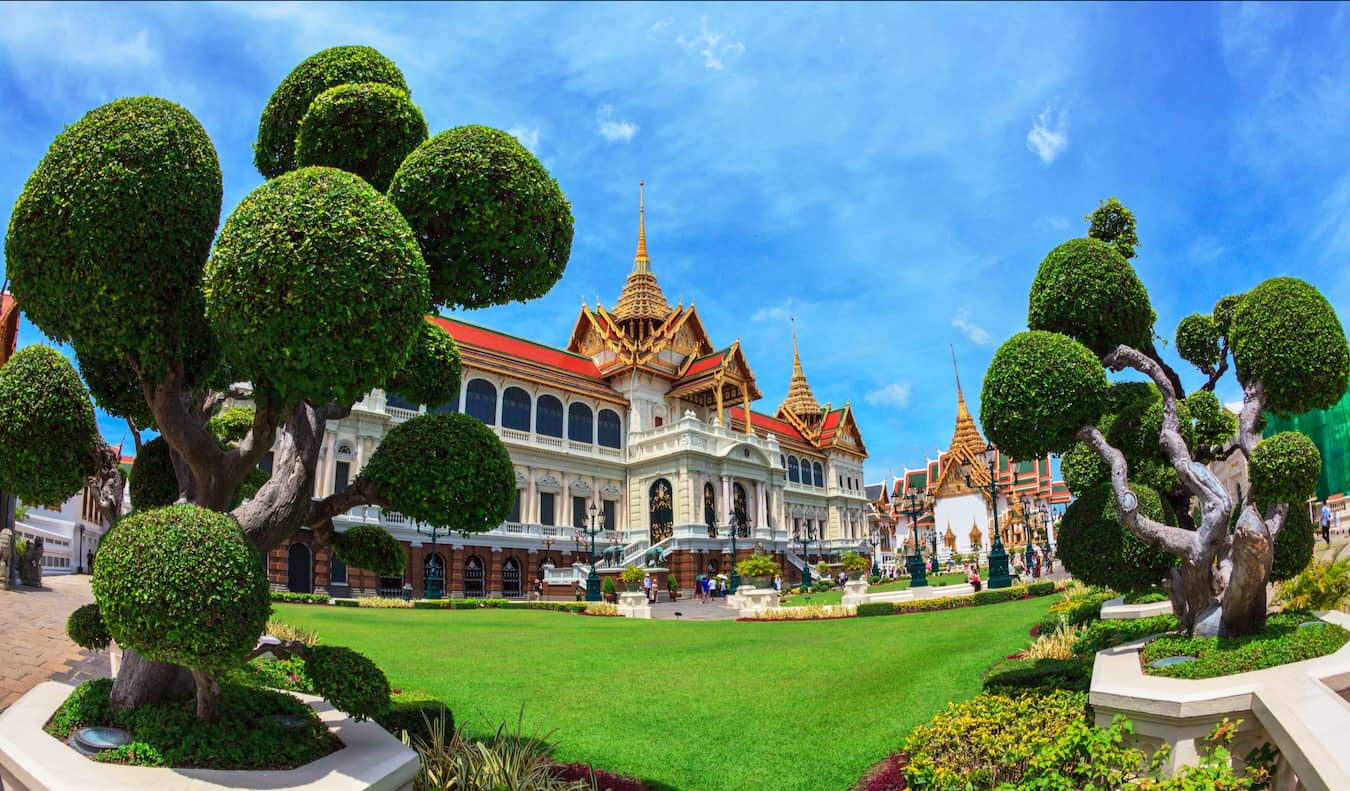The stunning exterior of the Grand Palace in Bangkok, Thailand on a bright and sunny day