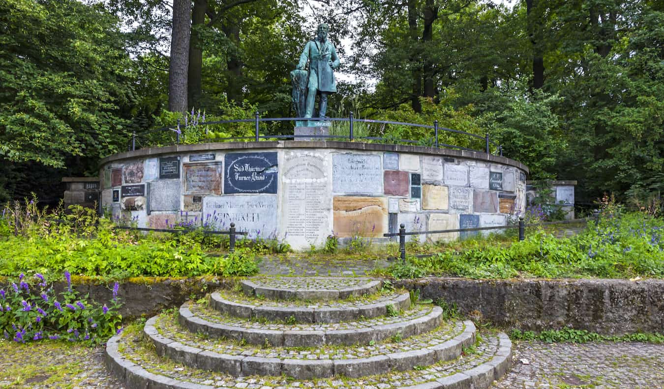 An old statue in a quiet park in NeukÃ¶lln, Berlin, Germany