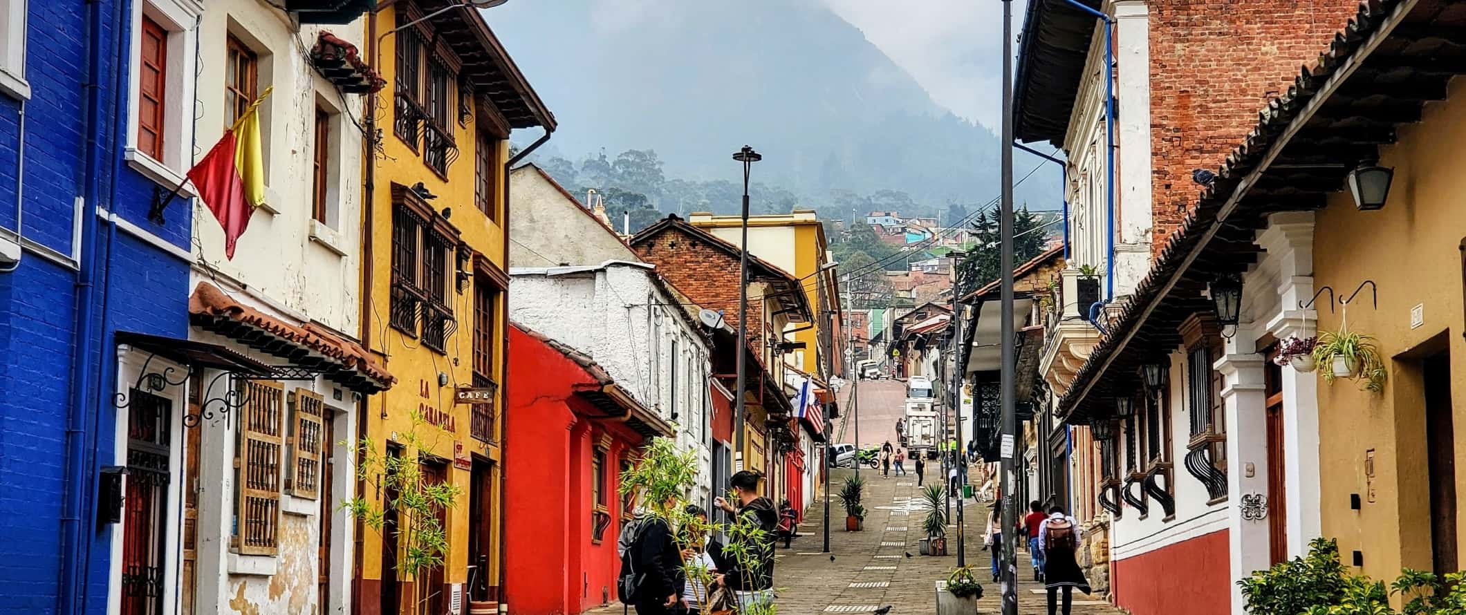 Street lined with colorful houses in the historic neighborhood of La Candelaria in Bogota, Colombia 
