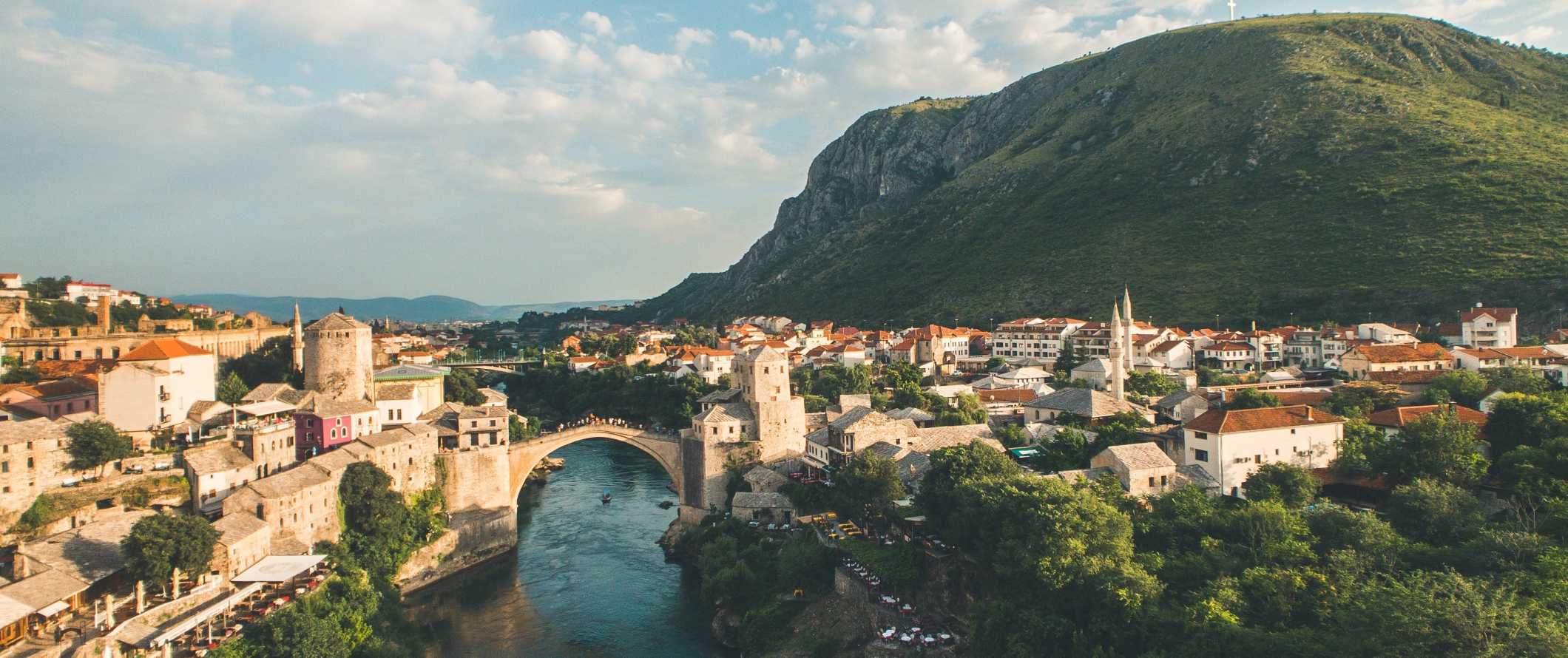 Panoramic view of the historic town of Mostar with its iconic stone arched bridge in Bosnia & Herzegovina