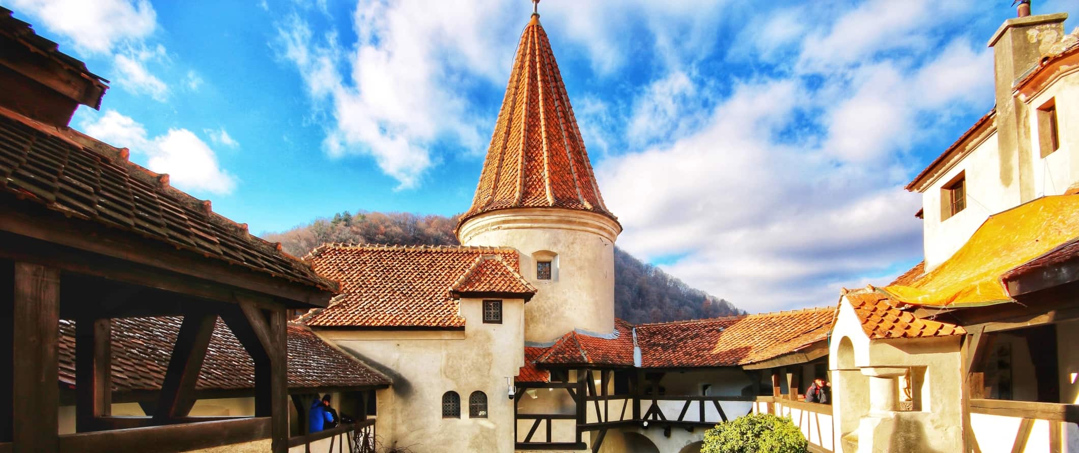 Turret and red-shingled roofs at Bran Castle in Brasov, Romania.