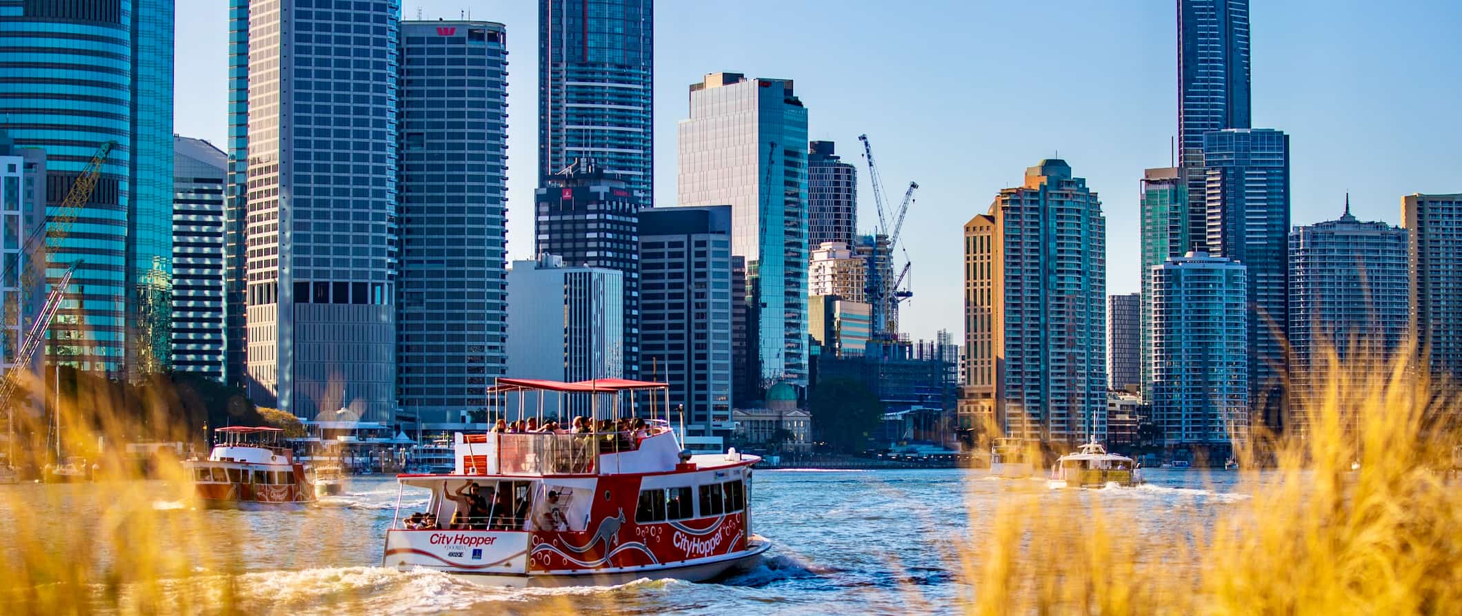 A boat crossing the water in sunny Brisbane, Australia