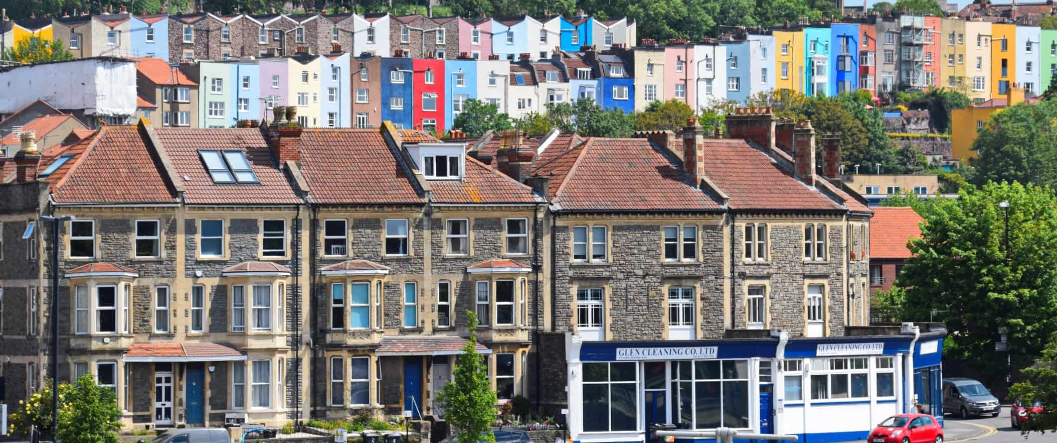 Tiers of colorful townhouses set into the hill in Bristol, England
