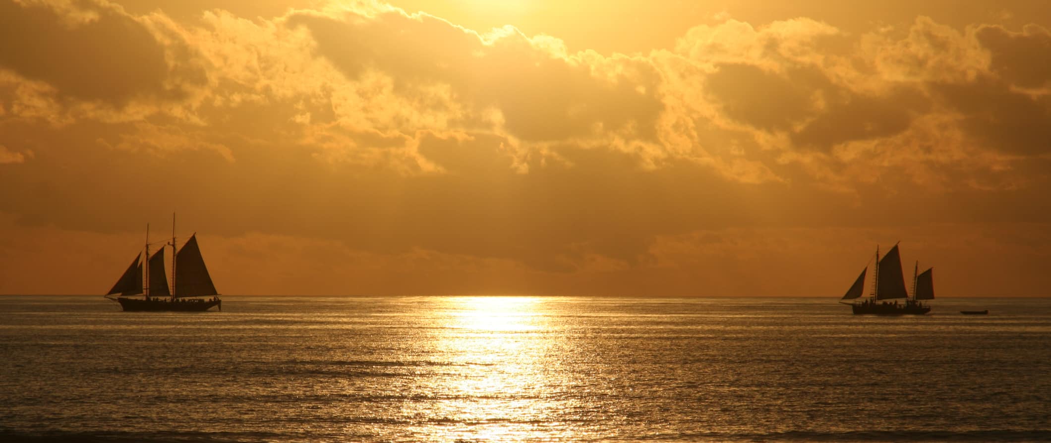 Peal ships out on the water at sunset near Broome, Australia