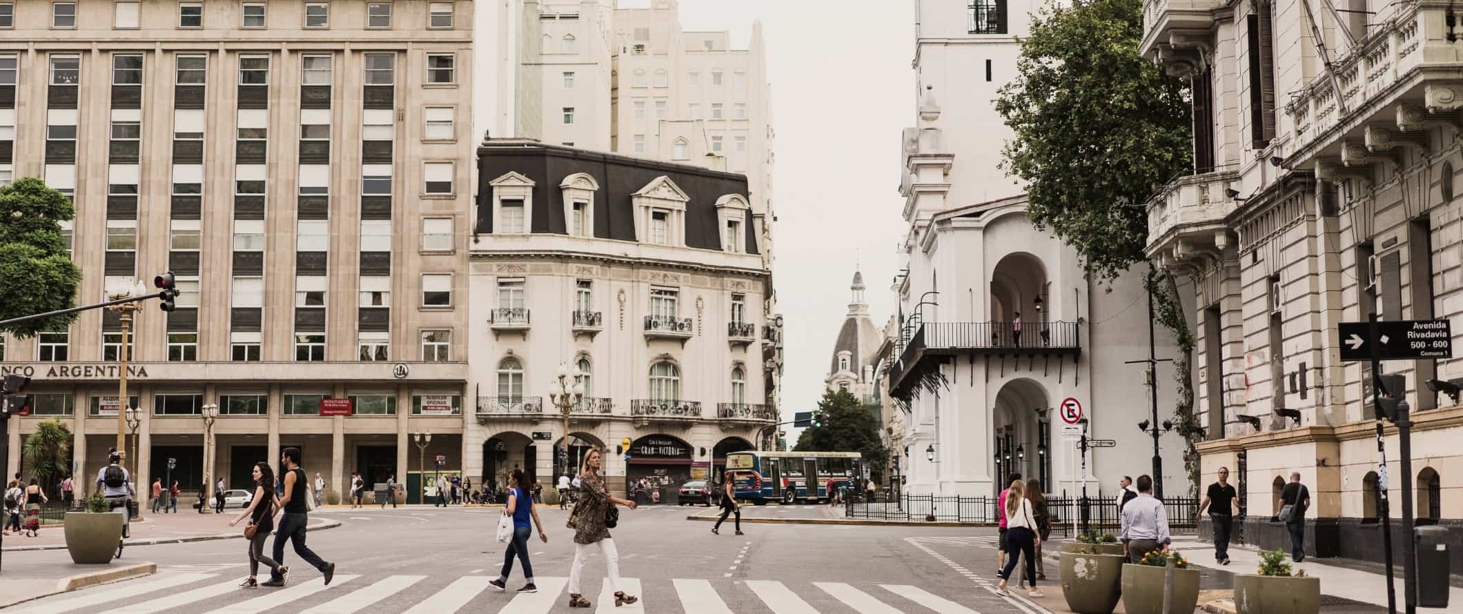 People walking around historic building-lined streets in Buenos Aires, Argentina