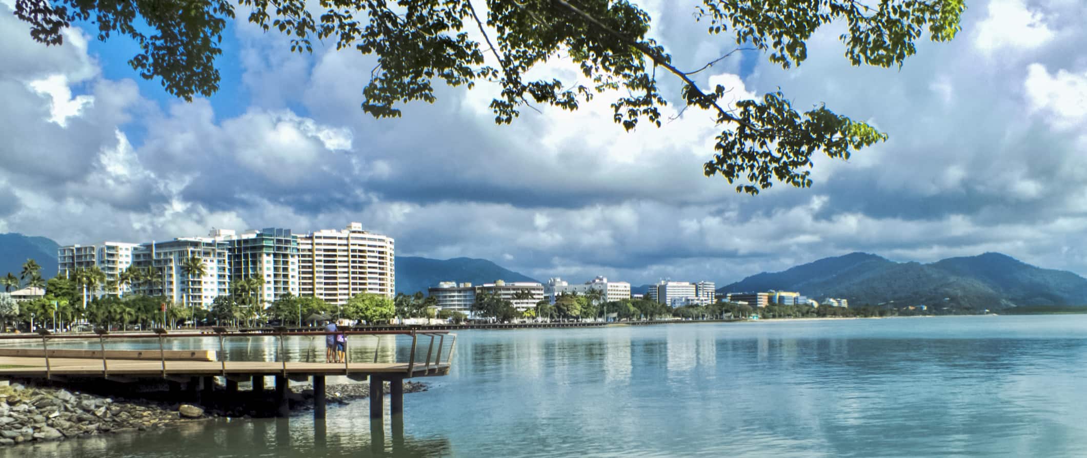 A quiet boardwalk along the water in the city of Cairns, Australia