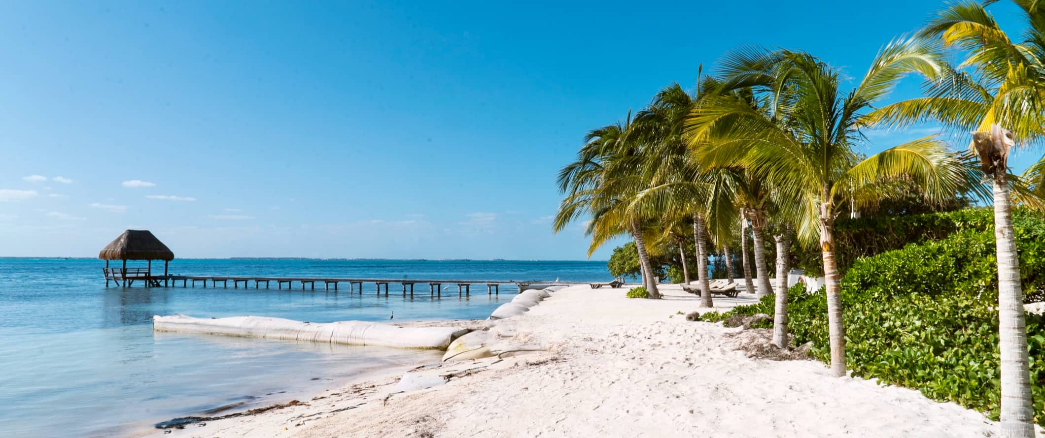 A quiet beach along the coast of Cancun, Mexico without anyone around