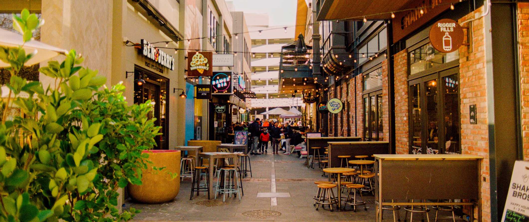 Pedestrian street lined with outdoor restaurant seating in Christchurch, New Zealand.