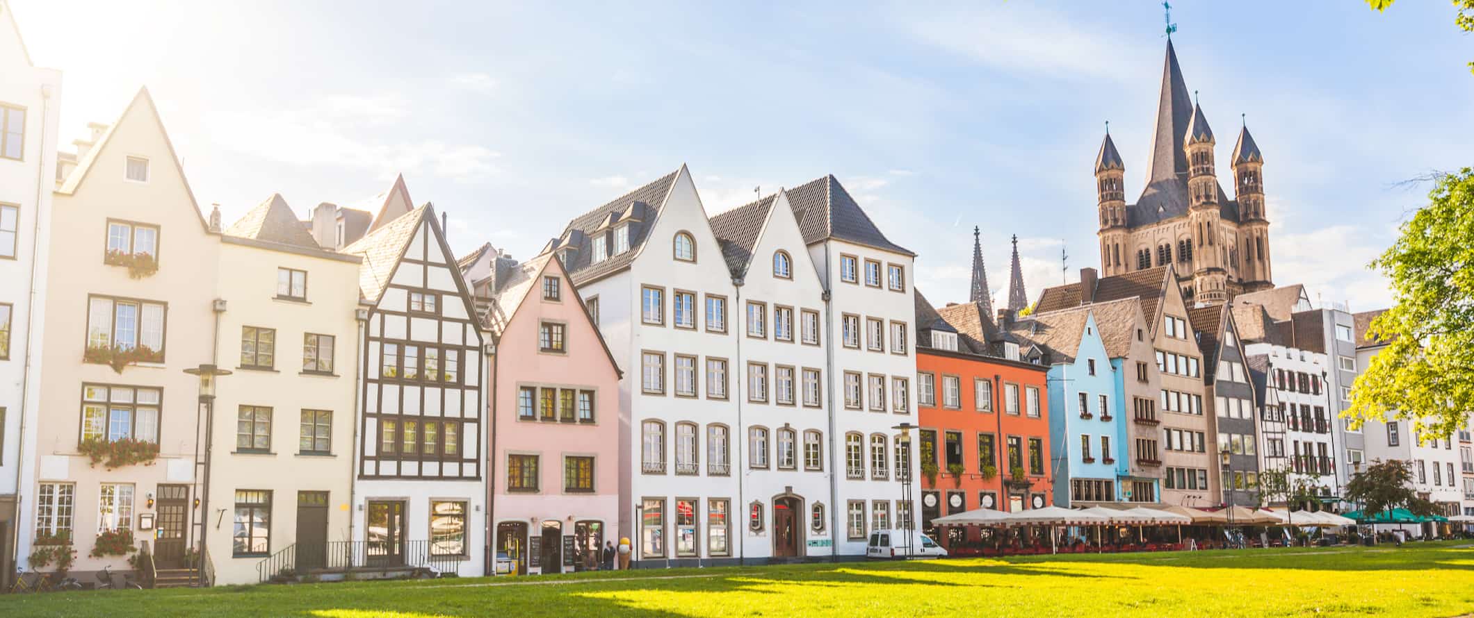 A row of colorful old houses in sunny Cologne, Germany