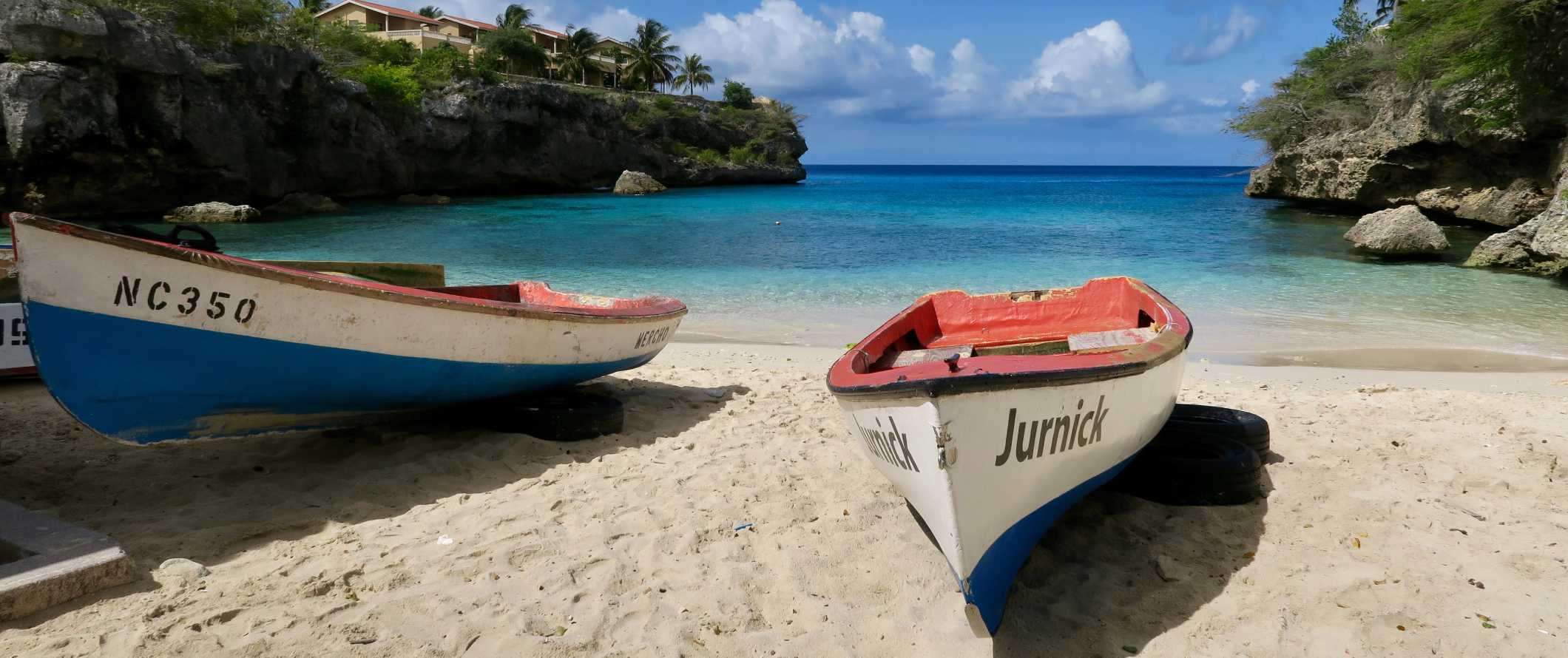 Row boats on a beach in the tropical island of Curaçao in the Caribbean