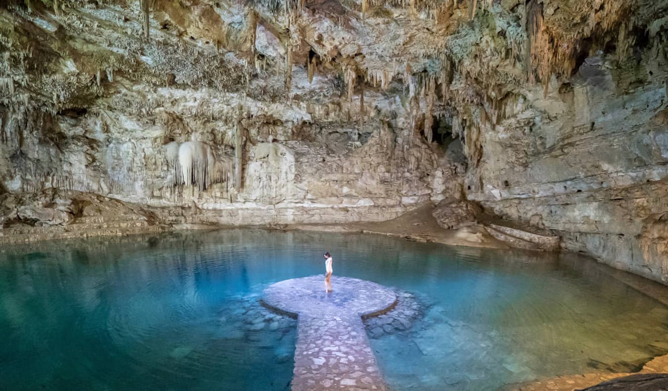 Solo female traveler Kristin Addiss in Mexico enjoy a huge cenote underground