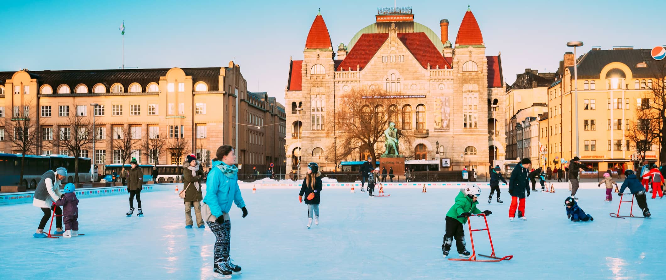 People skating and enjoying the snowy weather in beautiful Helsinki, Finland