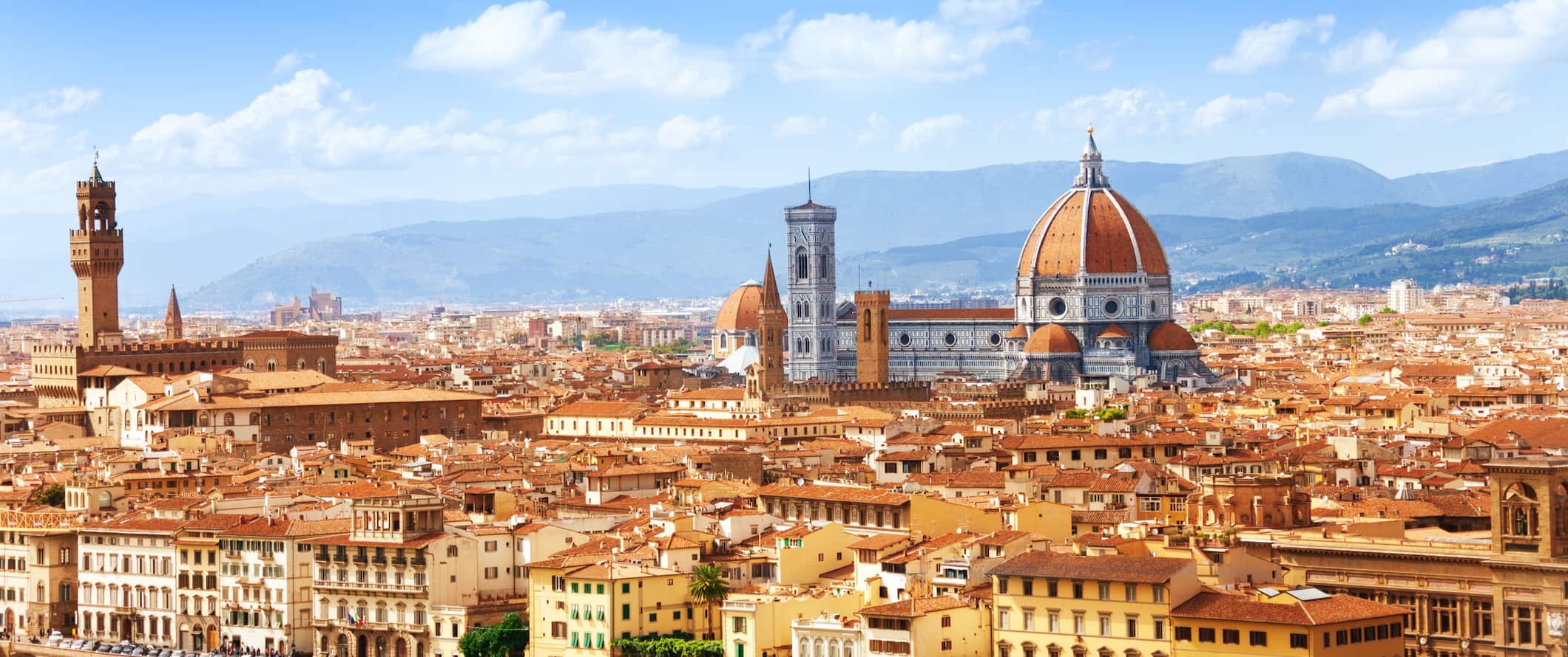 City skyline with red rooftops and the Duomo in Florence, Italy
