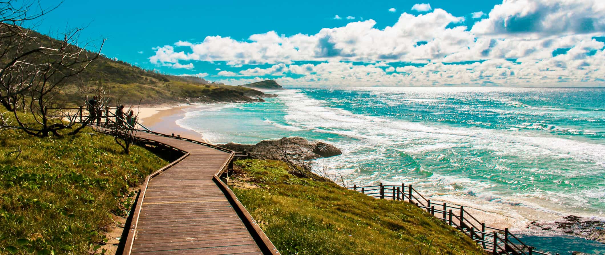 A wooden beach path that follows the stunning coast of tropical Fraser Island in Australia