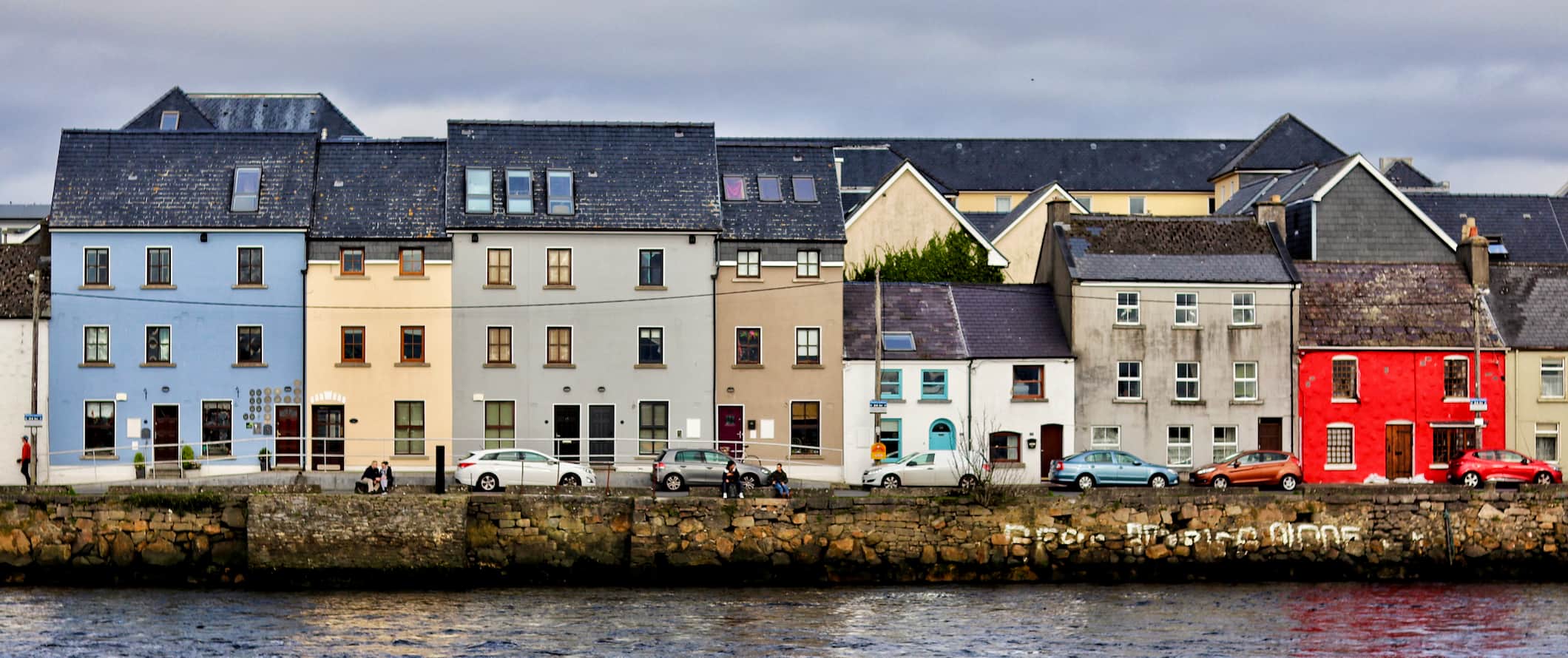 view of Galway, Ireland and the waterfront with colorful houses along the coast