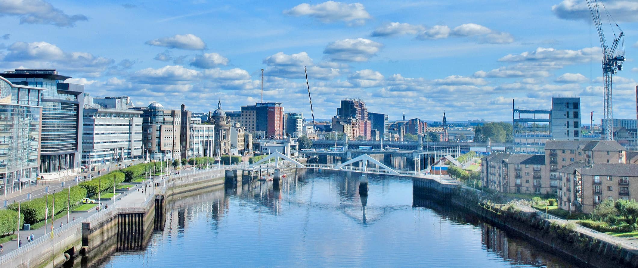 The skyline of Glasgow, Scotland divided by the river