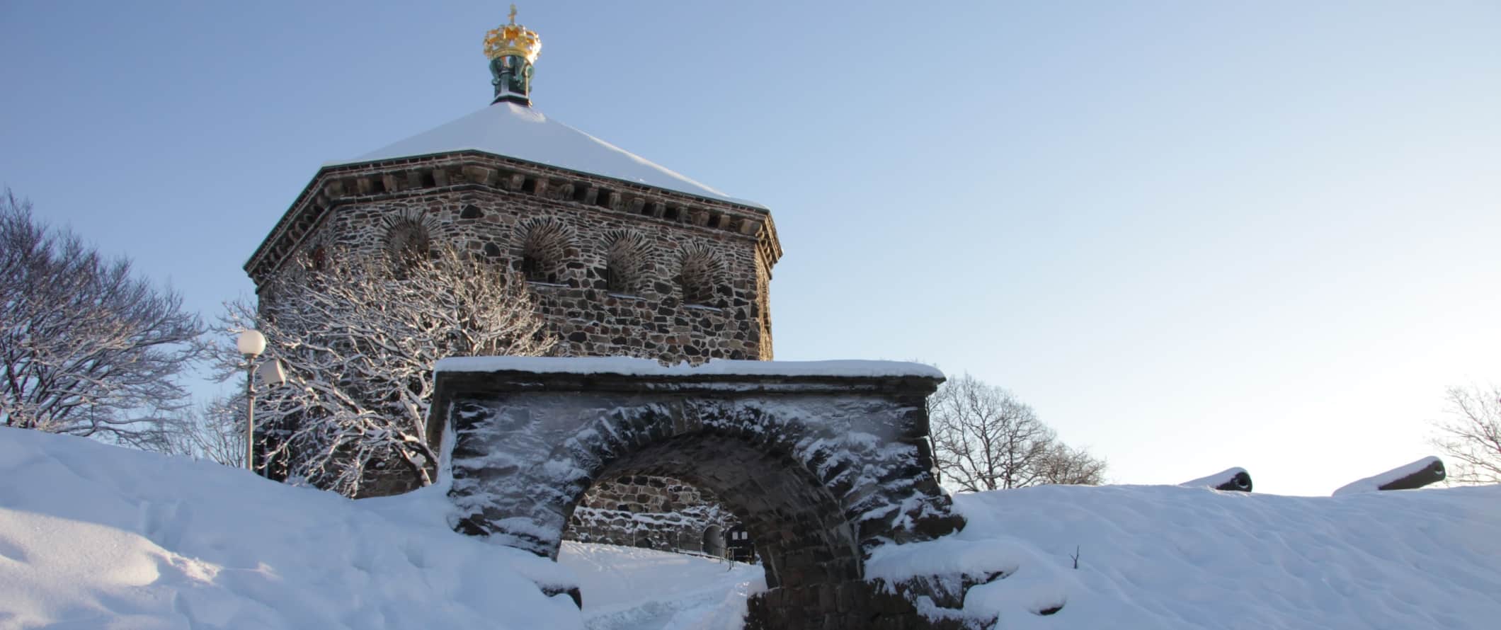 The stone gate at the fortress of Skansen Kronan covered in snow in Gothenburg, Sweden