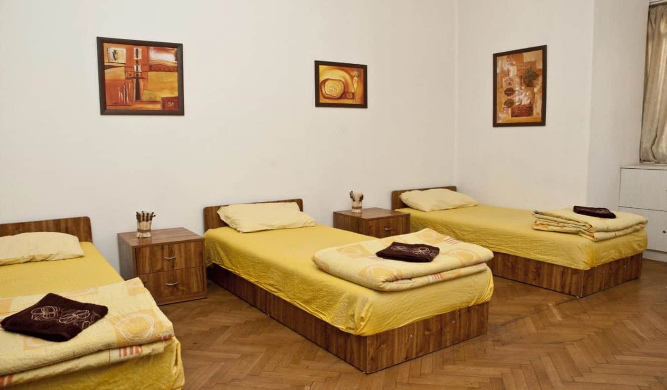 Room with three twin beds at Hostel Mostel in Bulgaria