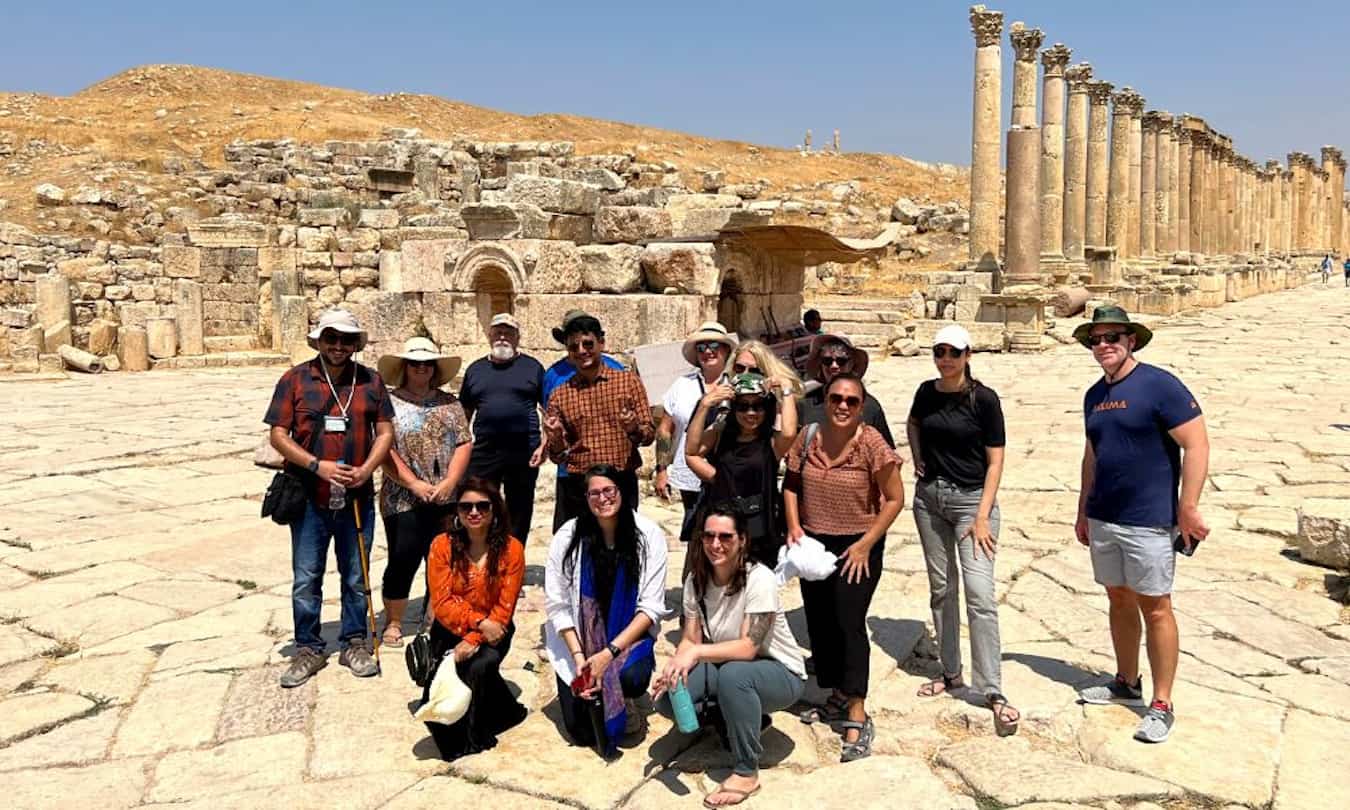 A TNN travel group takes a photo after exploring Jordan together.