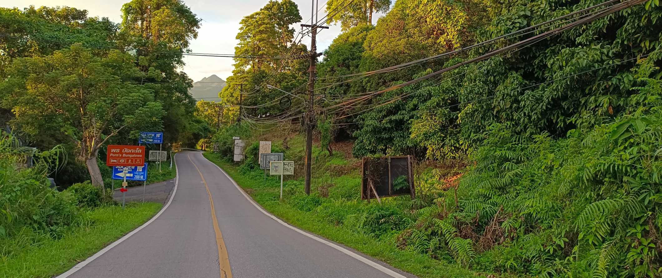 Winding road through the lush countryside of Ko Chang, Thailand