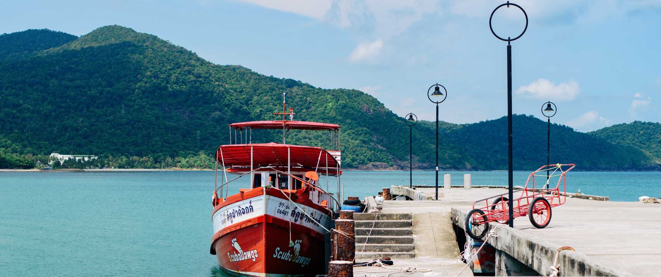 A ferry boat at a dock in Ko Chang, Thailand on a sunny day