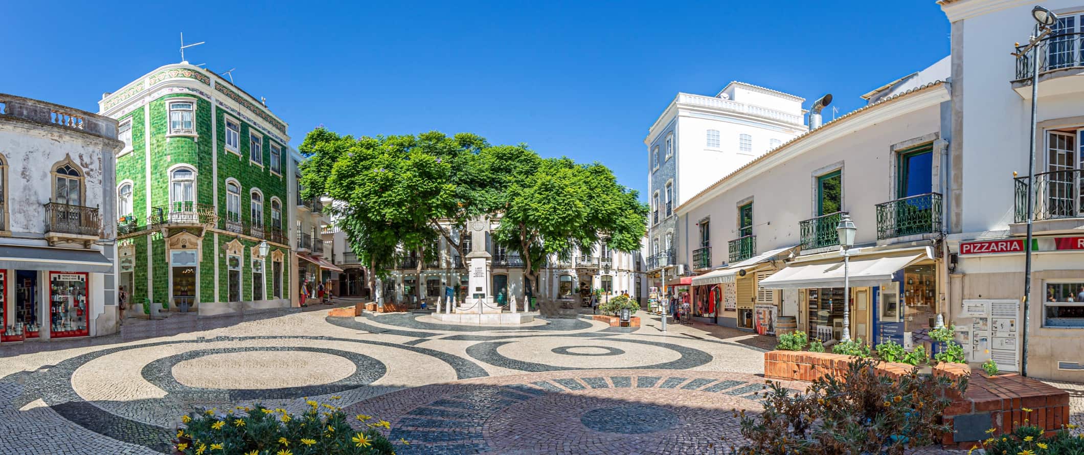 The charming town of Lagos, Portugal featuring an open square and colorful buildings