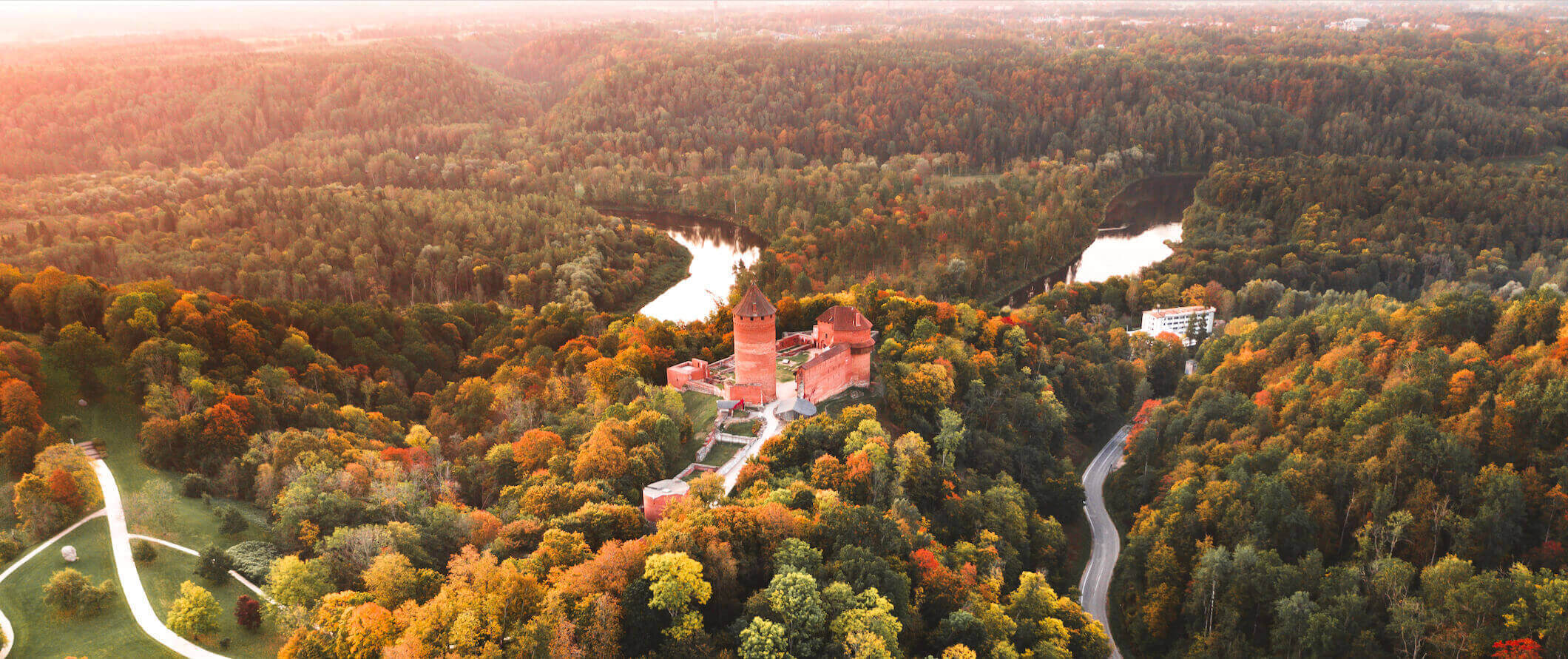A towering castle in the middle of a forest in Latvia