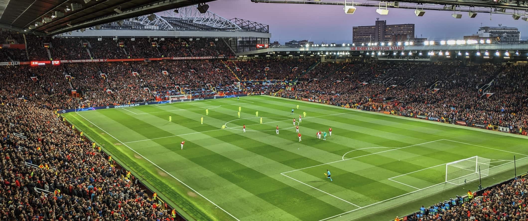 Football match being played in the Old Trafford stadium in Manchester, England