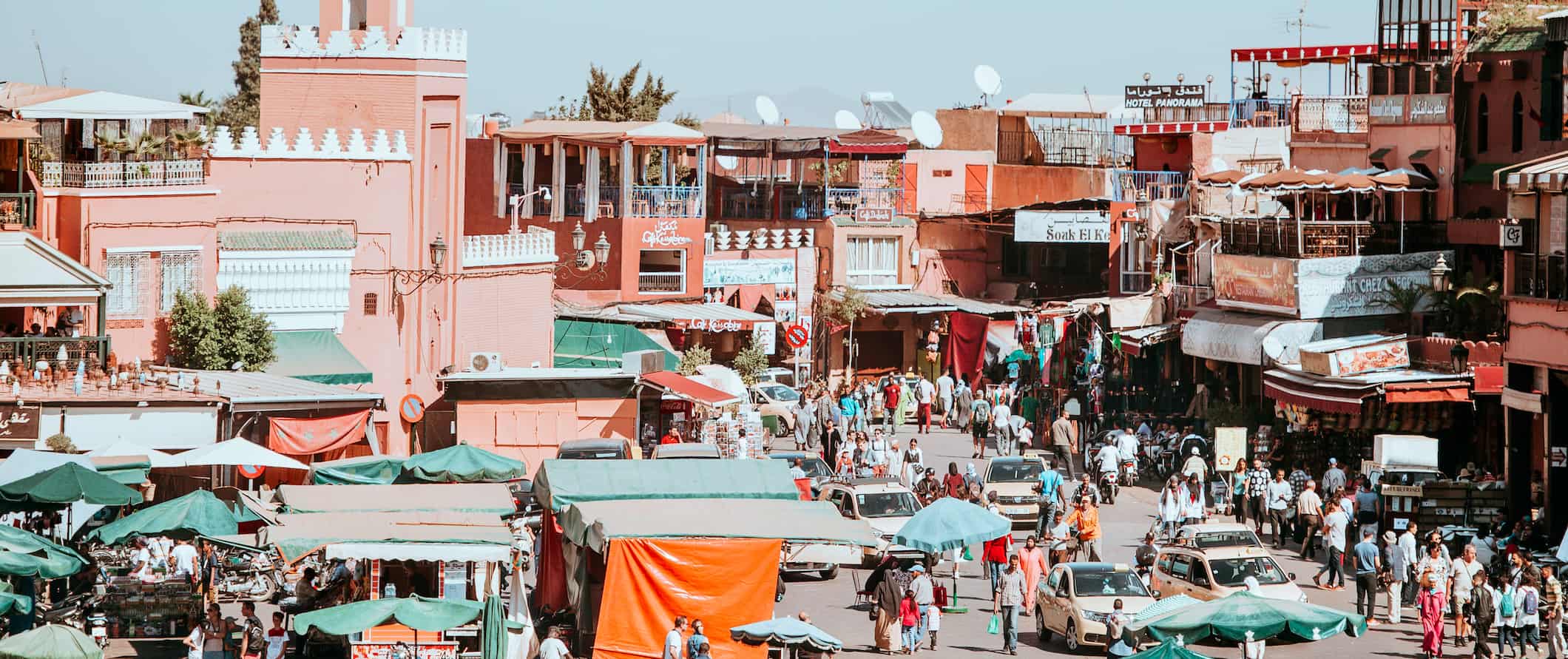 People and cars in the sprawling, hectic market of Marrakesh, Morocco