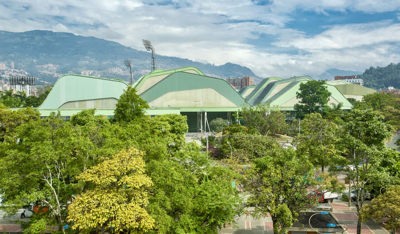 The huge soccer stadium in Medellin, Colombia surrounded by greenery