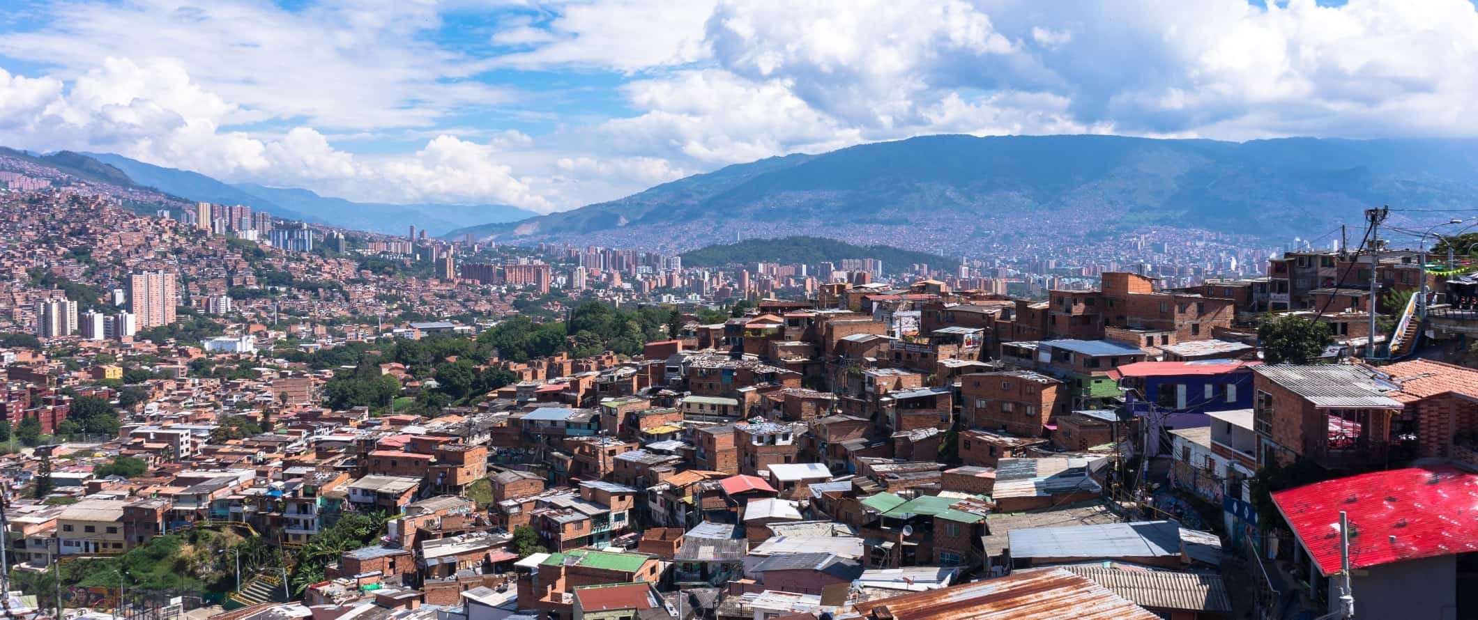 Panoramic views of the city of Medellin spread across the hills