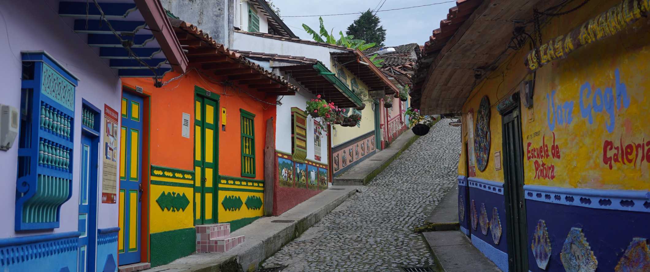 Cobblestone streets lined with bright, historic houses in the town of Guatapé near Medellin, Colombia