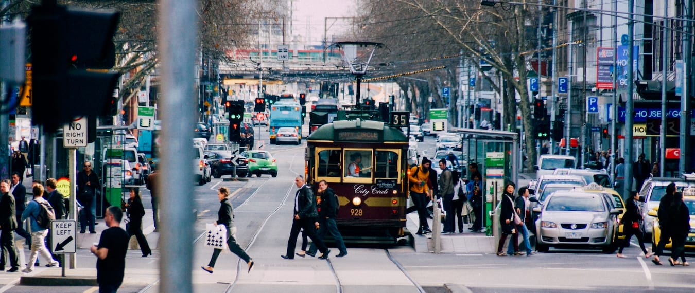 People walking around and taking the tram in downtown Melbourne, Australia