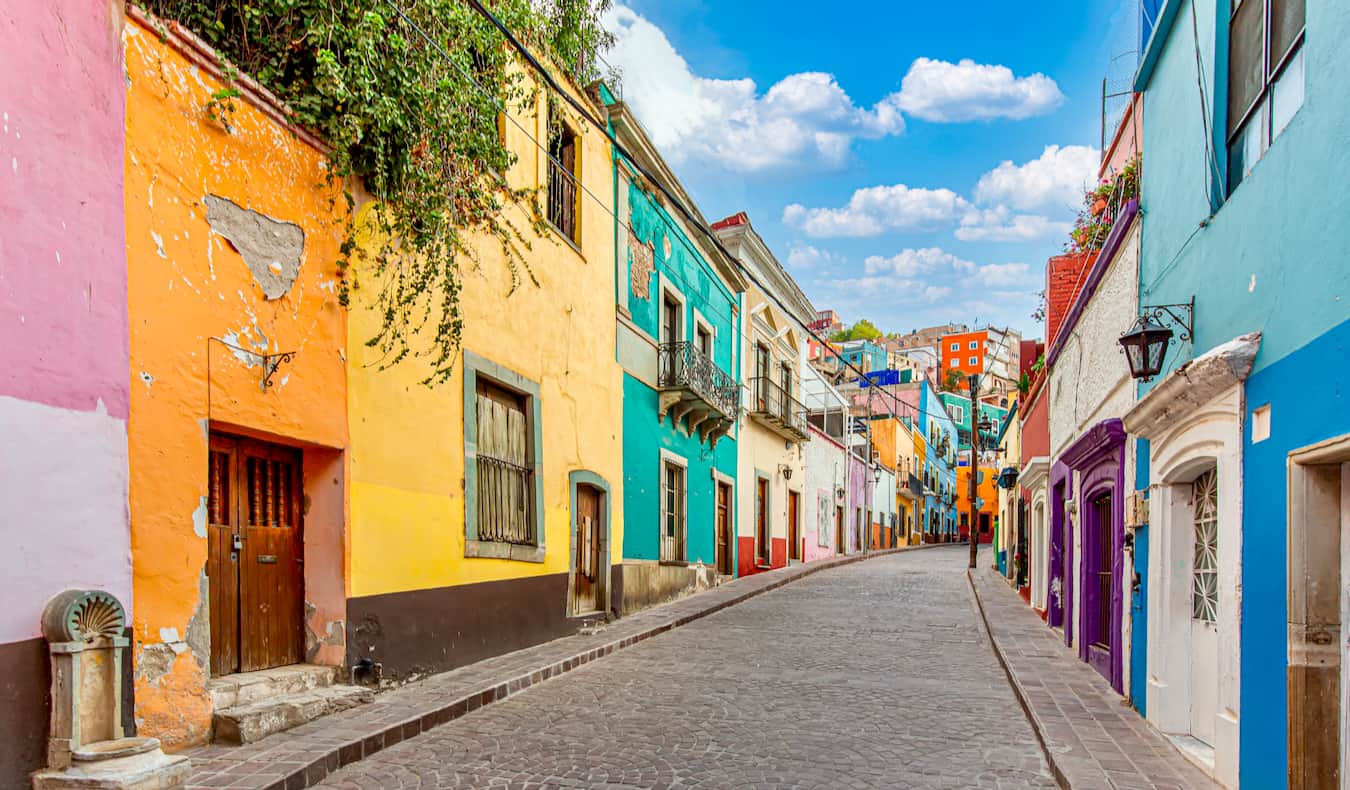 A colorful, empty cobblestone street in Mexico