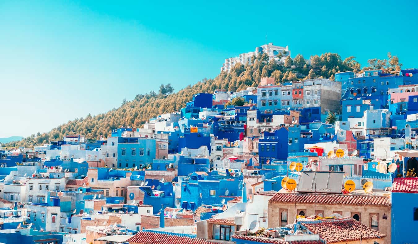 The traditional colorful houses of Morocco set along a small hill