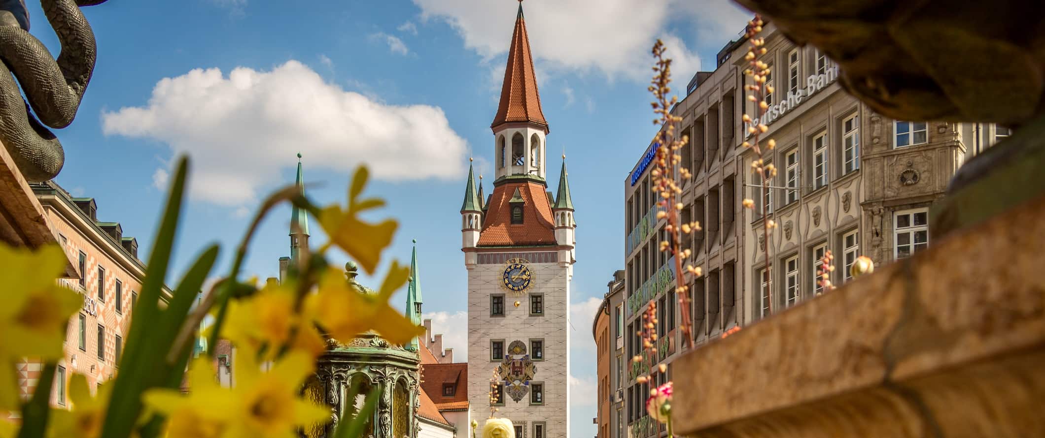 The historic old town of Munich, Germany during the spring with flower blooming near a church