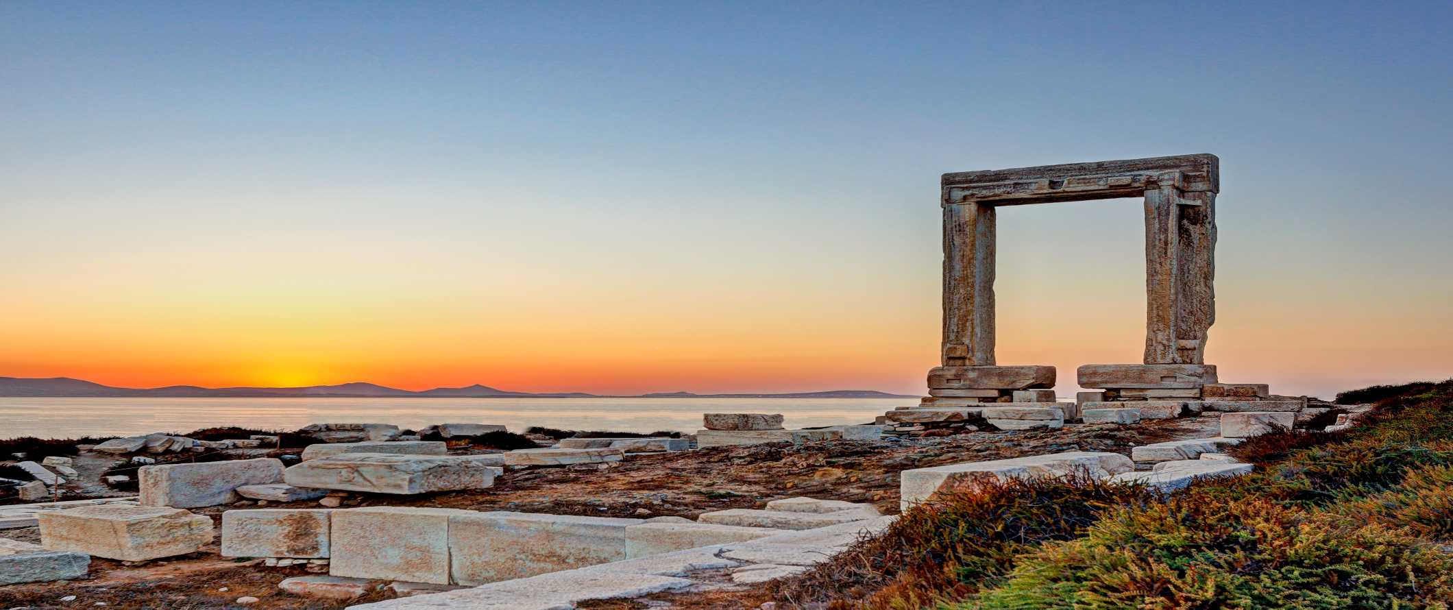 The marble Portara gate at sunset in Naxos, Greece.