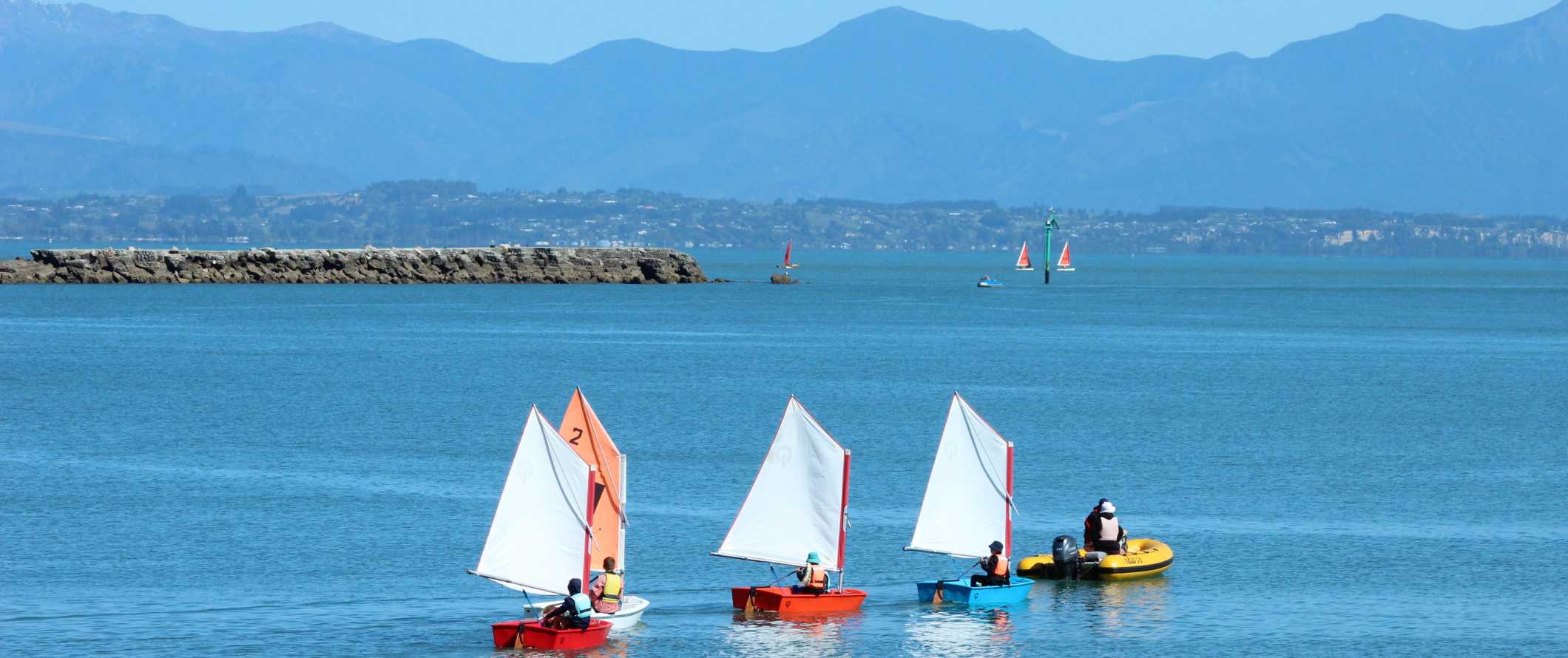 Tiny sailboats in the harbor near the town of Nelson in New Zealand.