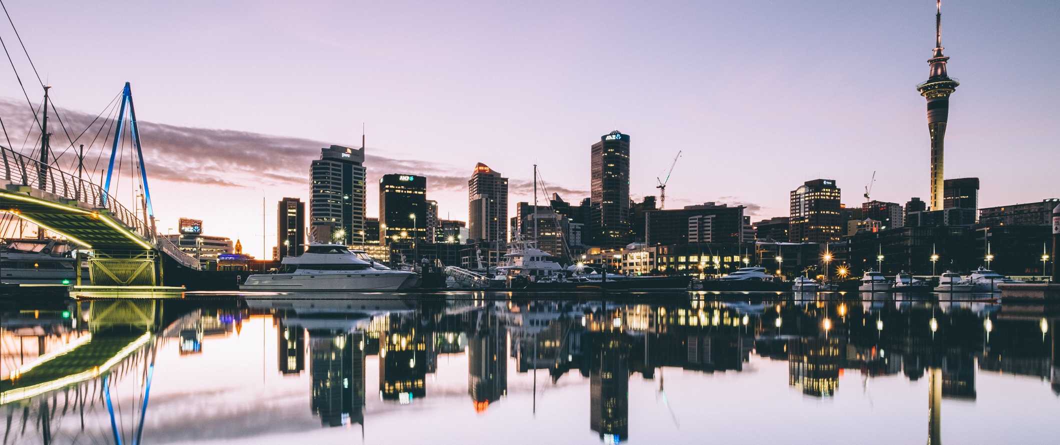 Auckland's harborfront at sunset in New Zealand.
