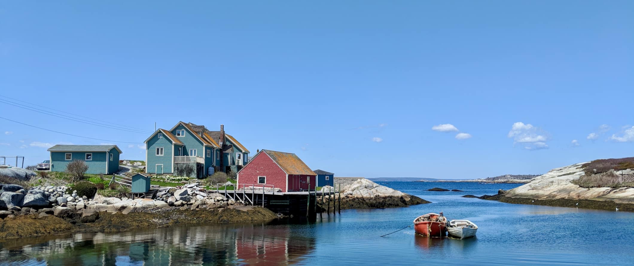 A quaint house along the rugged coast of sunny Nova Scotia, Canada