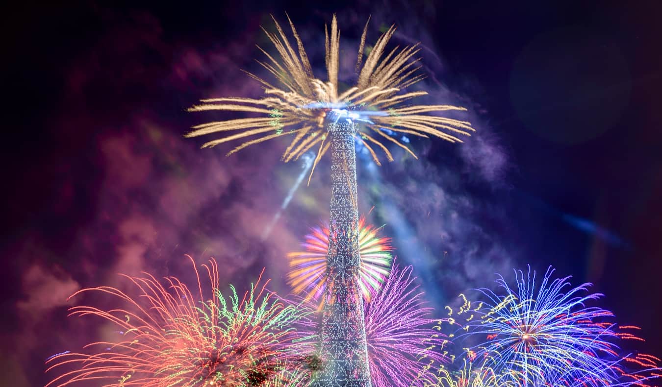 Fireworks going off in Paris near the Eiffel Tower