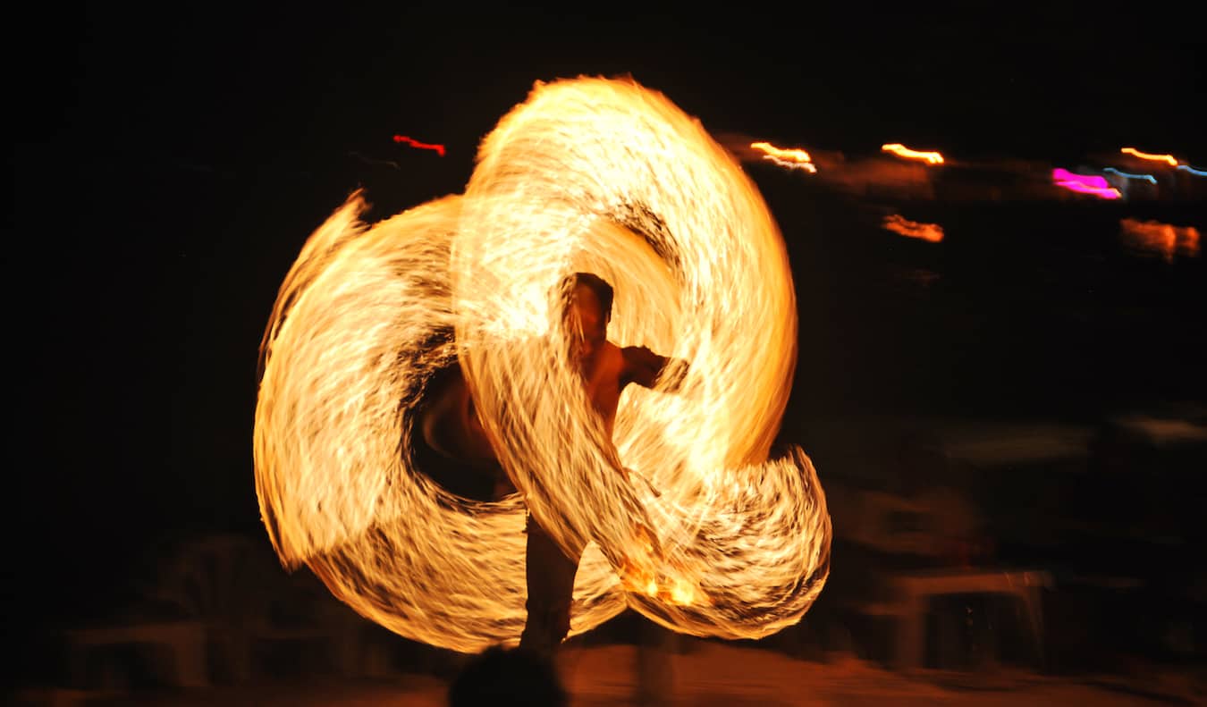 A fire dancer partying during the Full Moon Party in Thailand