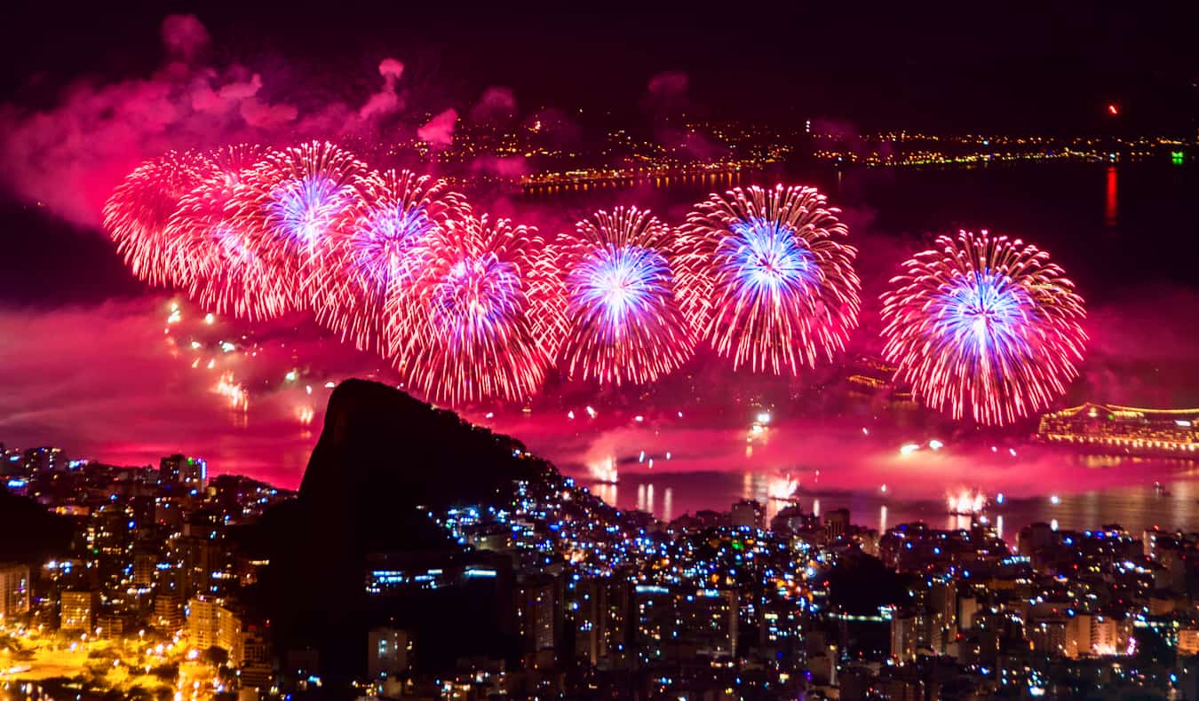 Bright fireworks exploding over the coast of Rio de Janeiro, Brazil during New Year's Eve