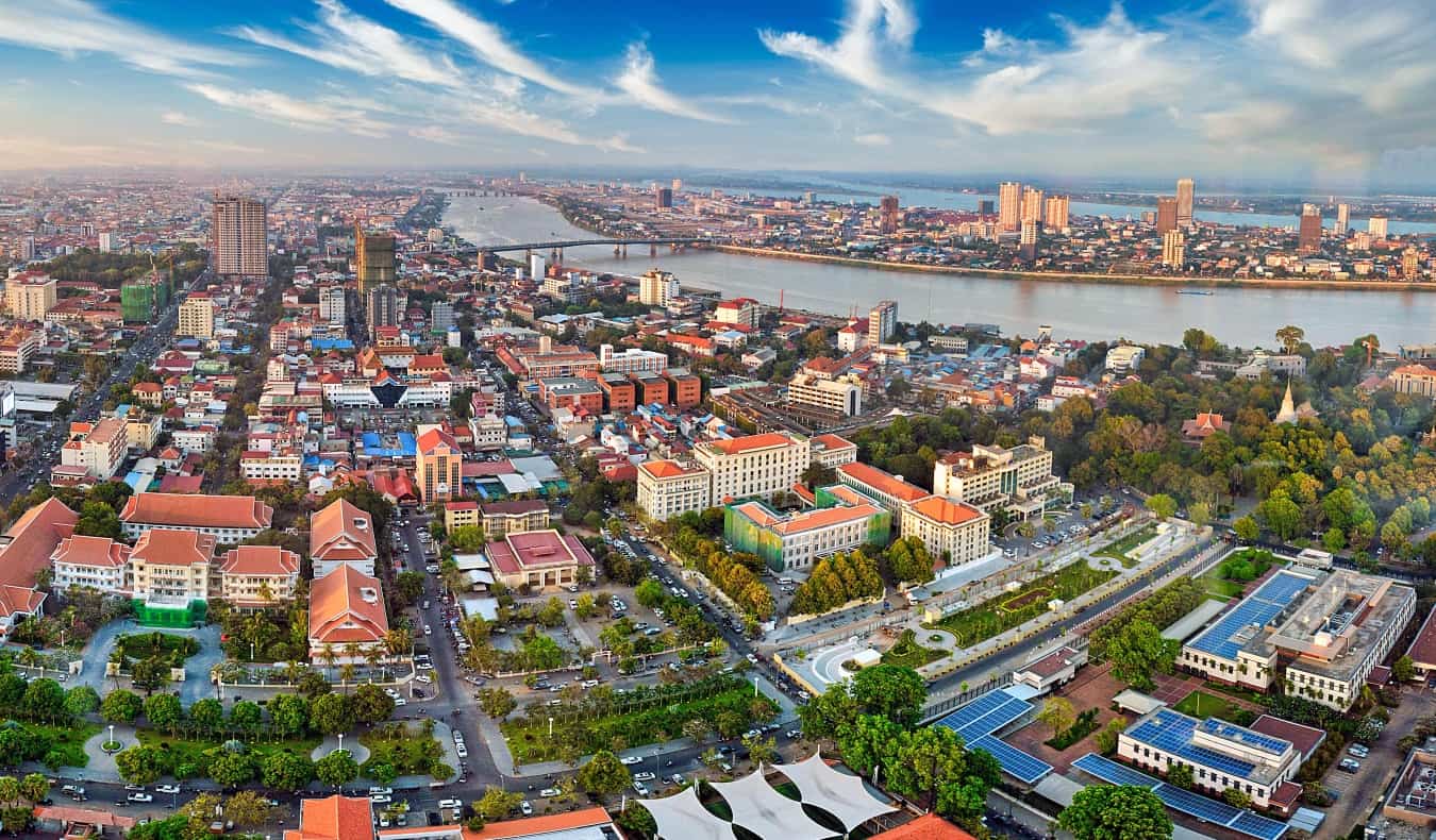 Aerial view over the cityscape of Phnom Penh, Cambodia“/><br />
Founded in 1434, <a href=